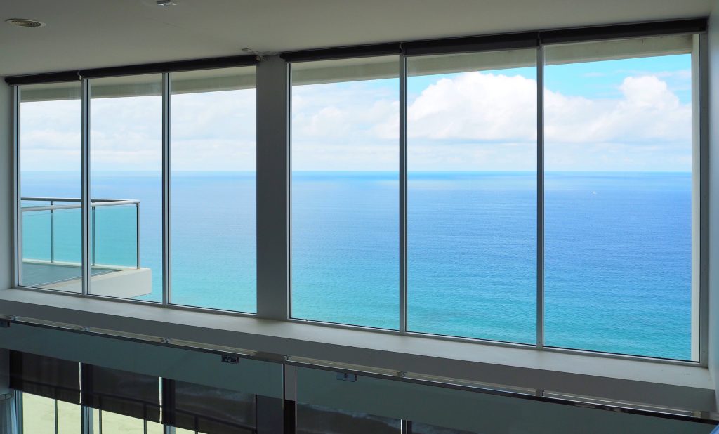 The view from the second floor of our apartment, a huge window wall looking out to the ocean, MAGIC!