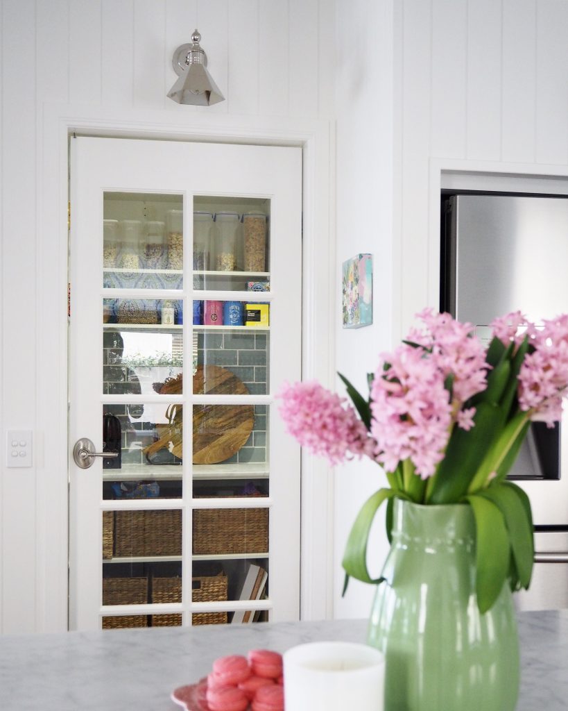 The walk-in pantry and fridge in the reclaimed space under the stairs.