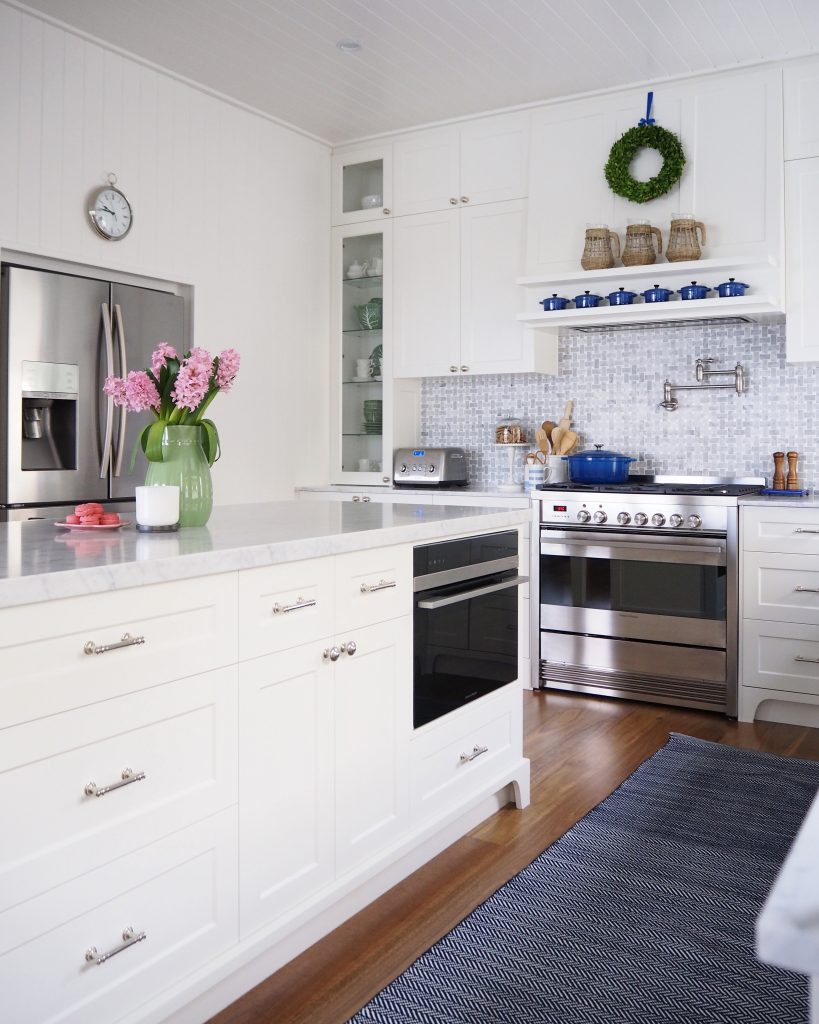 The freestanding cooker on the back wall and combination microwave oven in the island bench.